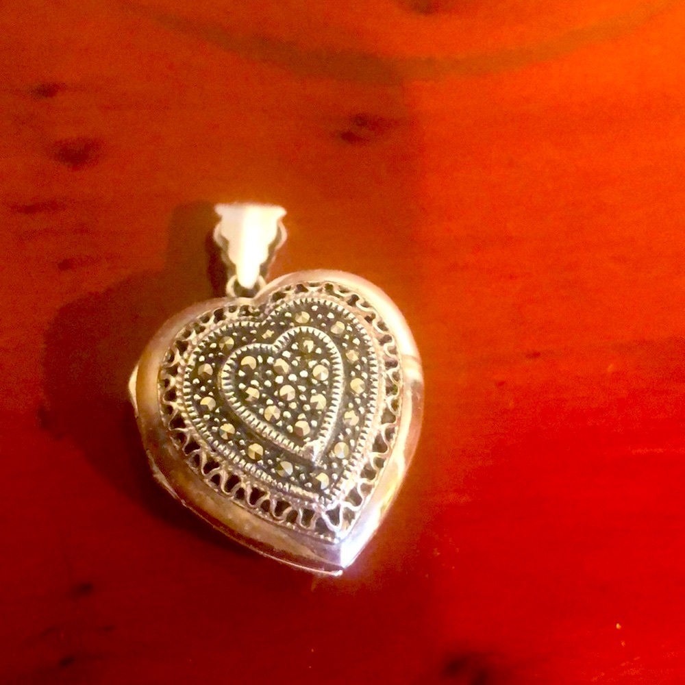Silver locket pendant with marcasite heart pattern